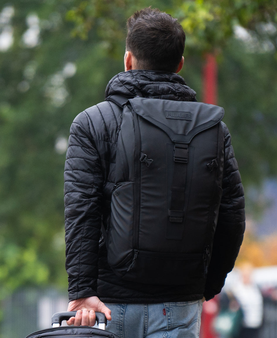 HUUB Travel Backpack – 24L commuter laptop bag, waterproof, helmet net, large clam opening, side handles